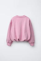 LABEL DETAIL BALLOON-HEM CROPPED SWEATSHIRT