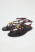 FLAT SUEDE SANDALS WITH METALLIC PIECE