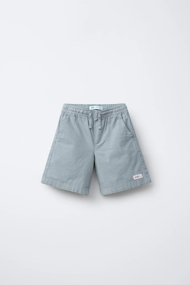 BERMUDA EN COTON COUPE AMPLE ÉTIQUETTE