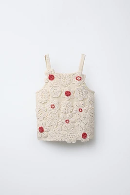 TOP EN MAILLE AVEC VERROTERIES
