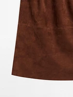 Jupe droite en cuir finition daim