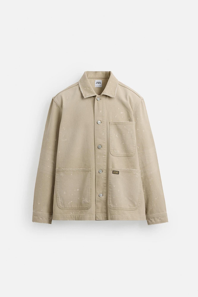 VESTE DÉLAVÉE À ÉCLABOUSSURES