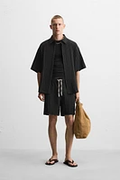 WRINKLED EFFECT JACQUARD BERMUDA SHORTS