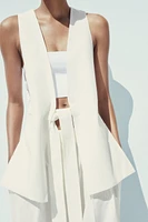 LONG VEST WITH VENTS AND MULTI-POSITION BELT