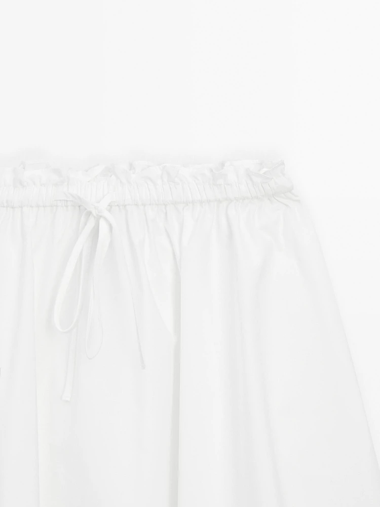 Flowing asymmetric midi skirt