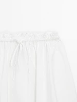 Flowing asymmetric midi skirt