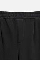 PANTALON DE JOGGING DÉLAVÉ À PLIS