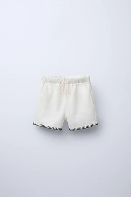 TEXTURED EMBROIDERED SHORTS