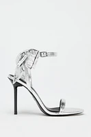 METALLIC EFFECT BOW SANDALS