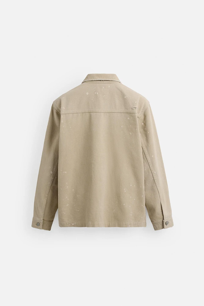 VESTE DÉLAVÉE À ÉCLABOUSSURES