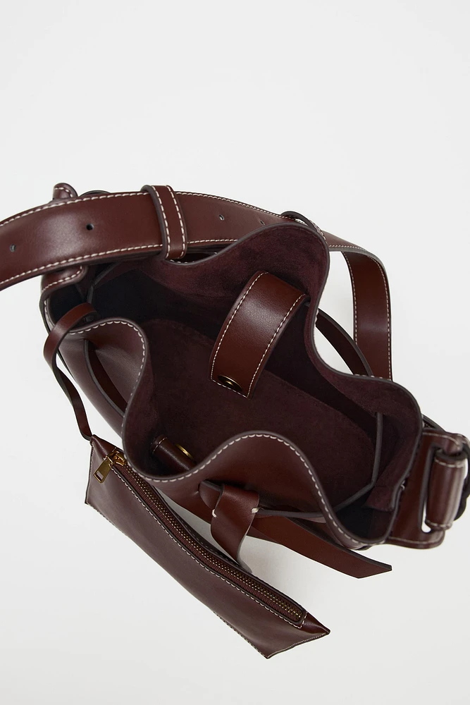KNOTTED TOPSTITCHED BUCKET BAG