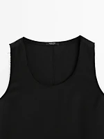 Long sleeveless satin blouse