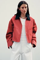 VESTE CIRÉE À COL EN MATIÈRES VARIÉES