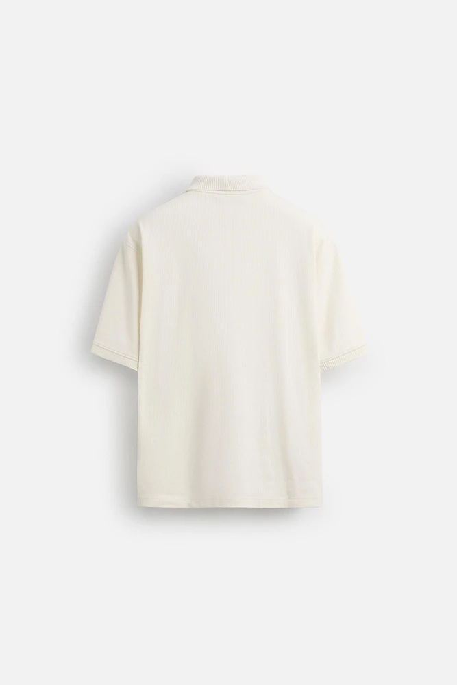POLO À TEXTURE AVEC ZIP