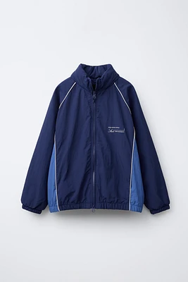 WATER REPELLENT TEXT PRINT HOODED RAINCOAT