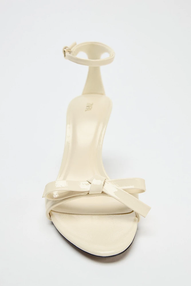 BOW HEELED SANDALS