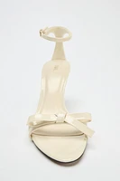 BOW HEELED SANDALS