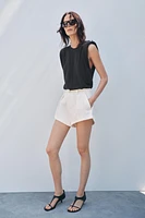 WASHED EFFECT T-SHIRT WITH SHOULDER PADS