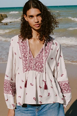 BLOUSE IMPRIMÉE À POMPONS