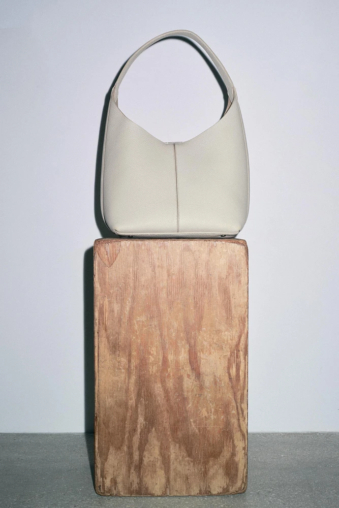 GRAINED LEATHER BUCKET BAG