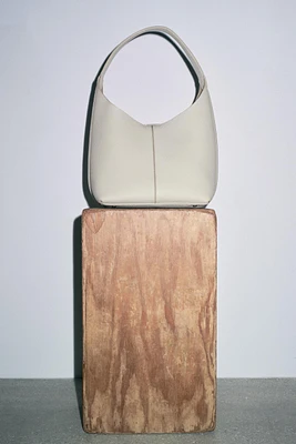 GRAINED LEATHER BUCKET BAG