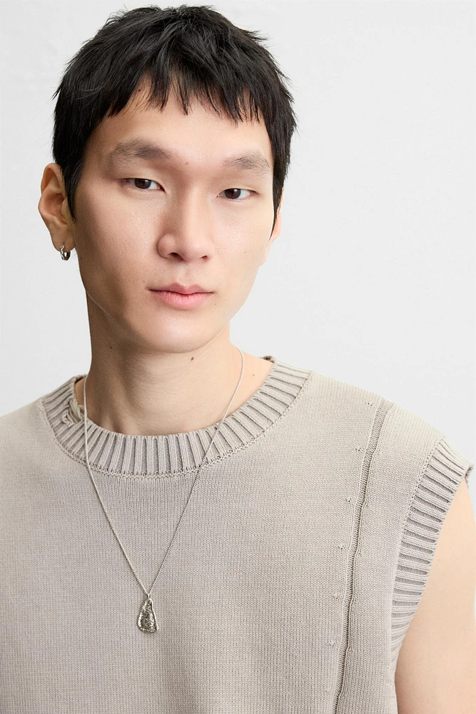 DISTRESSED KNIT VEST