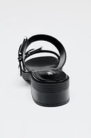FLAT BUCKLED SANDALS