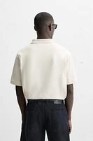 POLO À TEXTURE AVEC ZIP