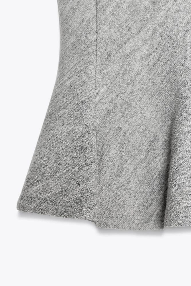 TEXTURED PEPLUM TOP