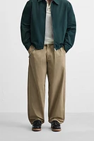 PANTALON RELAXED FIT À PLIS