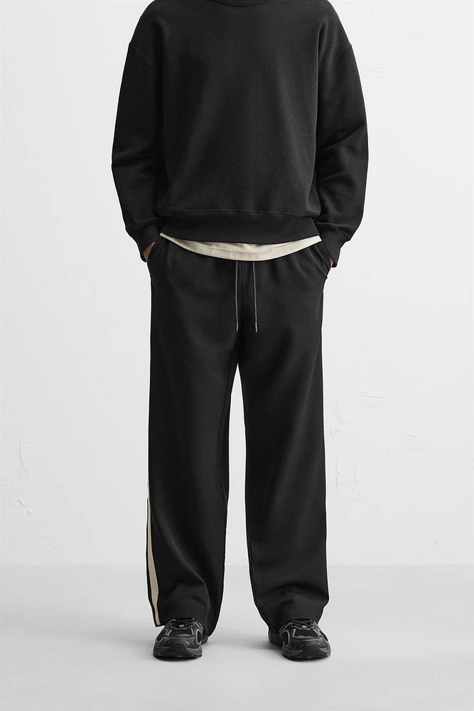 TECHNICAL PANTS WITH BANDS