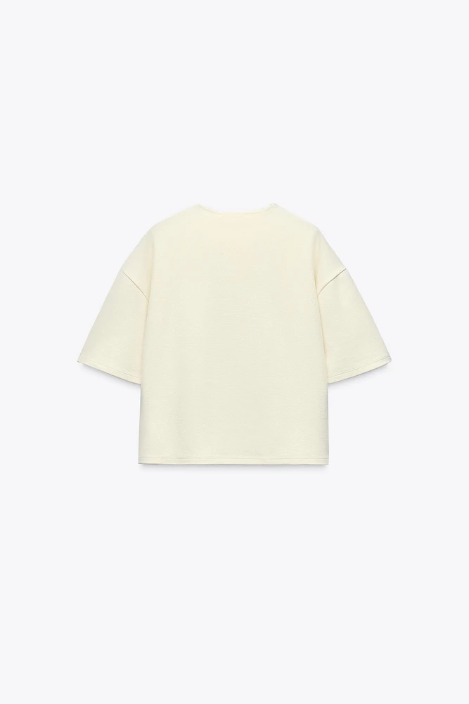 BUCKLE SHORT SLEEVE TOP
