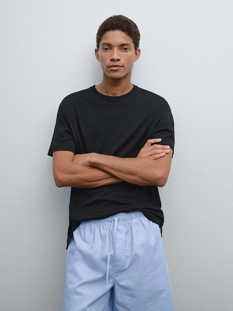 Short sleeve pyjama top and striped trousers