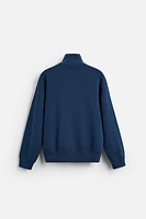 PULL À COL ZIP