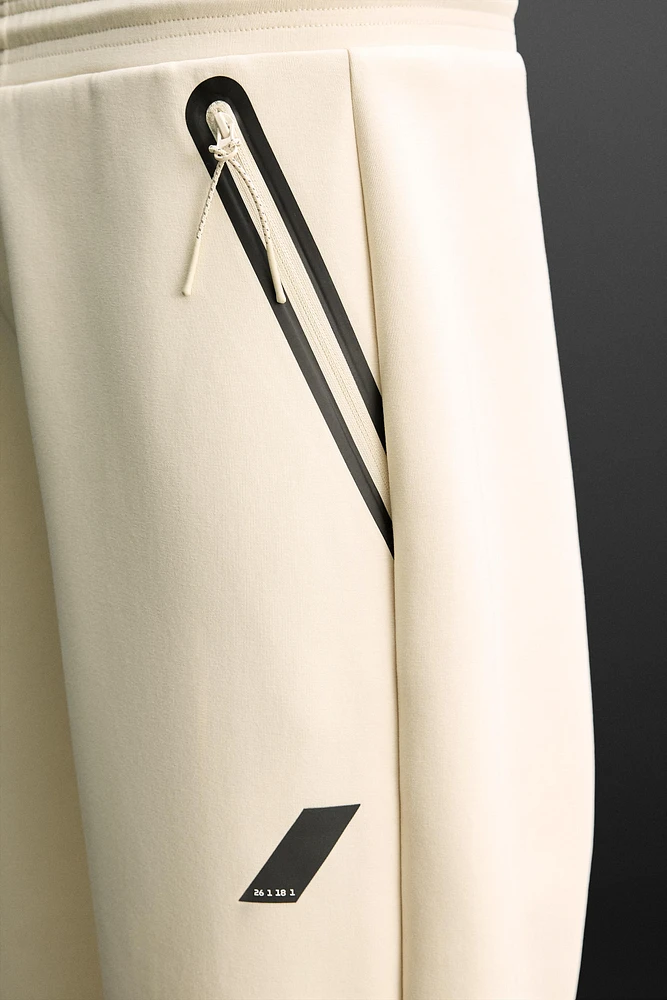 TECHNICAL ZIPPER JOGGER PANTS
