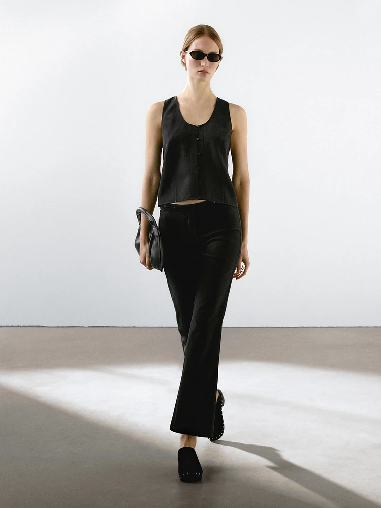 Flared trousers with waist detail