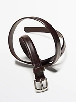 Leather belt with arched buckle