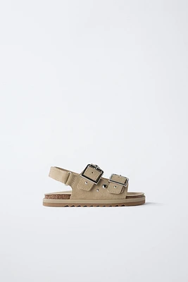 SANDALES À CLOUS EN CUIR