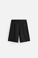 TEXTURED PLEATED SHORTS