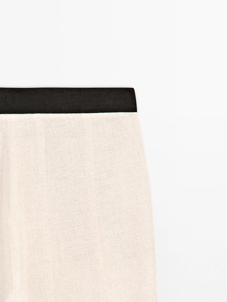 Pantalon flare taille contrastante