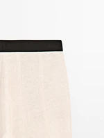 Pantalon flare taille contrastante