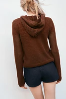 GILET EN MAILLE À CAPUCHE