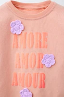 TEXT AND FLOWER APPLIQUÉ T-SHIRT