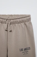 PLUSH WIDE LEG TEXT PANTS