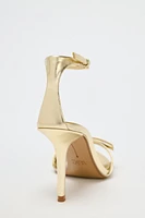 METALLIC EFFECT BOW HEELED SANDALS
