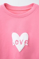 RAISED TEXT PRINT T-SHIRT