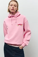 SWEAT À CAPUCHE IMPRIMÉ