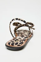 ANIMAL PRINT BOW FLAT SANDALS
