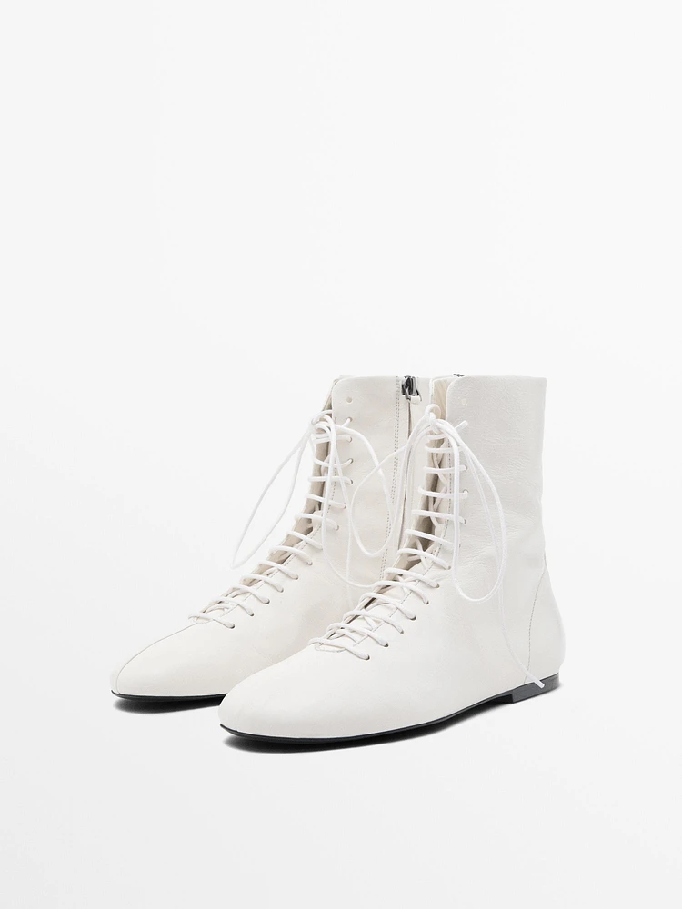 Lace-up flat ankle boots