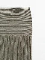 Long pleated skirt with flecked detail